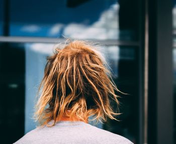 View of a person looking at the window