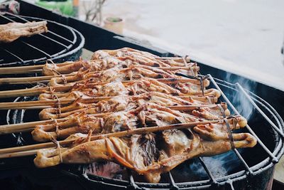High angle view of meat on barbecue grill