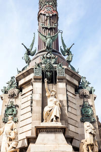 Low angle view of statue against sky