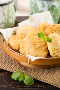 Tea served with biscuits in wicker basket