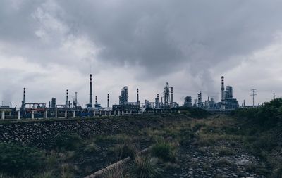 Panoramic view of factory against sky