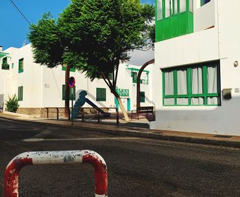 Street by building in city