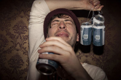 Portrait of man holding drinking glass