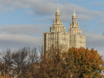 Low angle view of building against cloudy sky