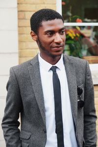 Portrait of young man standing outdoors
