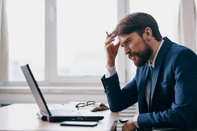 Businesswoman working at desk in office