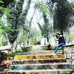 Side view of boy on staircase