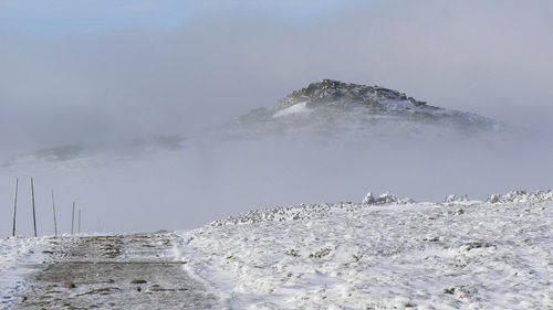 Scenic view of mountains against sky during winter