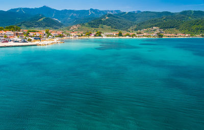 Scenic view of sea against mountains