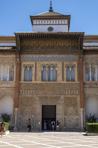 Facade of historic building against clear sky