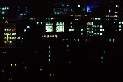 Illuminated buildings in city at night