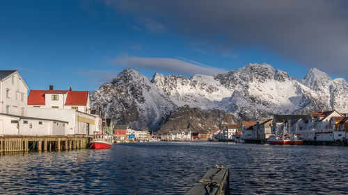 Scenic view of snowcapped mountains against blue sky