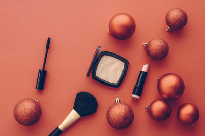 Directly above shot of beauty products on pink background