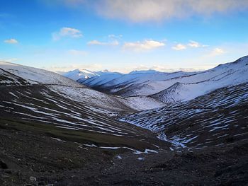 Scenic view of snowcapped mountains against sky
