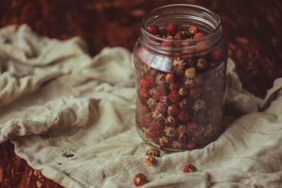 Close-up of fruits in jar on table