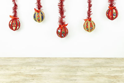 Multi colored decoration hanging against wall