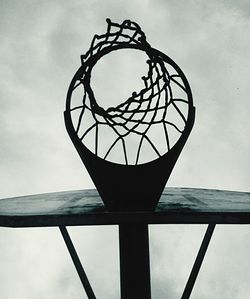 Low angle view of metal structure against sky