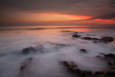 Scenic view of sea against sky during sunset