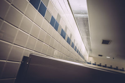 Low angle view of tiled wall