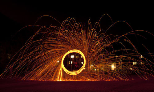 Low angle view of wire wool against sky at night