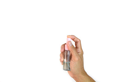 Close-up of person hand against white background