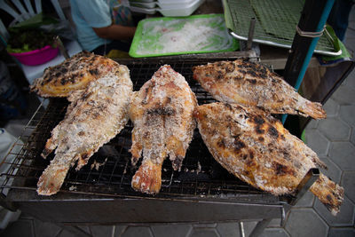 High angle view of meat on barbecue grill