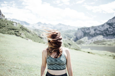 Carefree woman enjoying on mountain