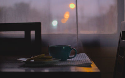 Tea cup with sopaipillas or oven baked dough in the afternoon, steam and low light bokeh