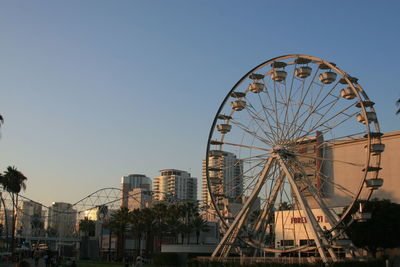 Low angle view of ferris wheel against sky