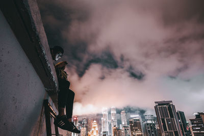 Cityscape against cloudy sky