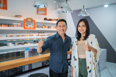 Portrait of young woman standing in store