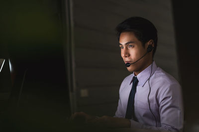 Portrait of young man using mobile phone