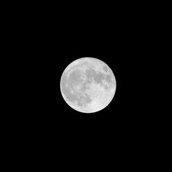 Scenic view of full moon against black sky