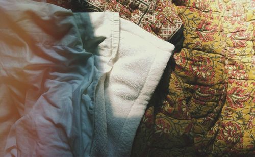 High angle view of crumpled blanket on bed