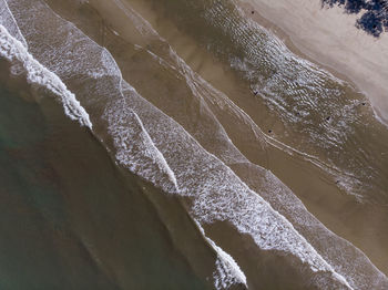 High angle view of surf on beach