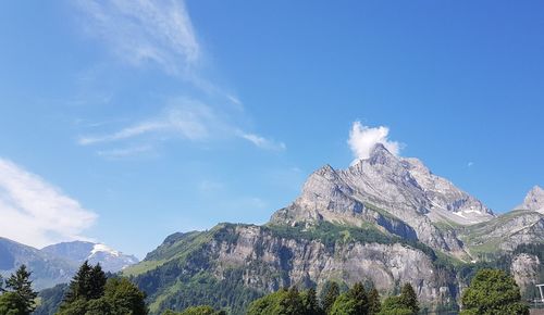 Low angle view of mountain range against sky