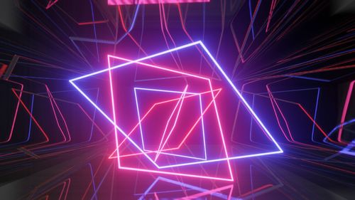 Low angle view of illuminated lights at night