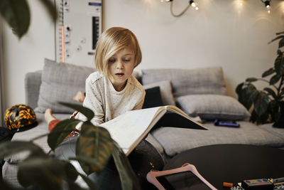 Girl holding open notebook