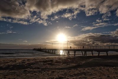 Scenic view of beach against sky during sunset