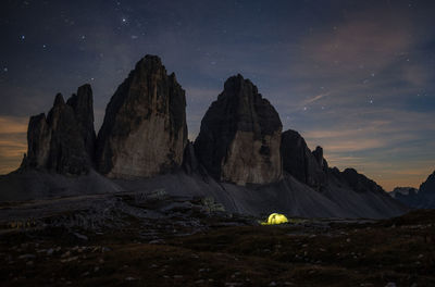 Scenic view of mountains against sky at night