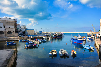 Boats moored at harbor