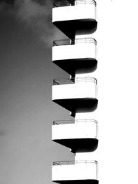 Low angle view of information sign against sky