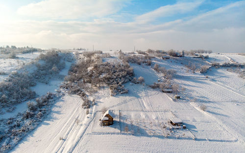 High angle view of snow covered landscape against sky