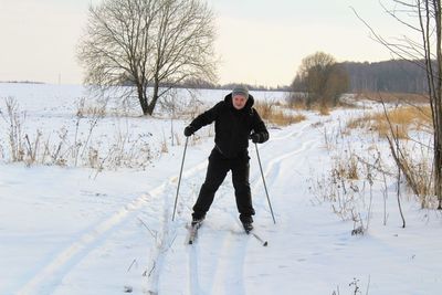 Full length of man standing on snow field