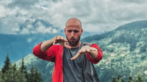 Portrait of young man standing outdoors