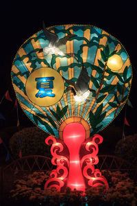 Low angle view of illuminated lantern at night