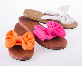 Close-up of colorful footwear on white background