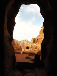 Buildings seen through cave