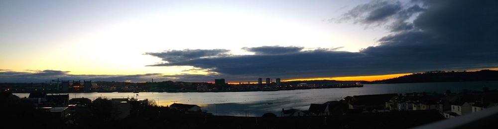 View of harbor at sunset