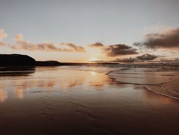 Scenic view of sea against sky during sunset